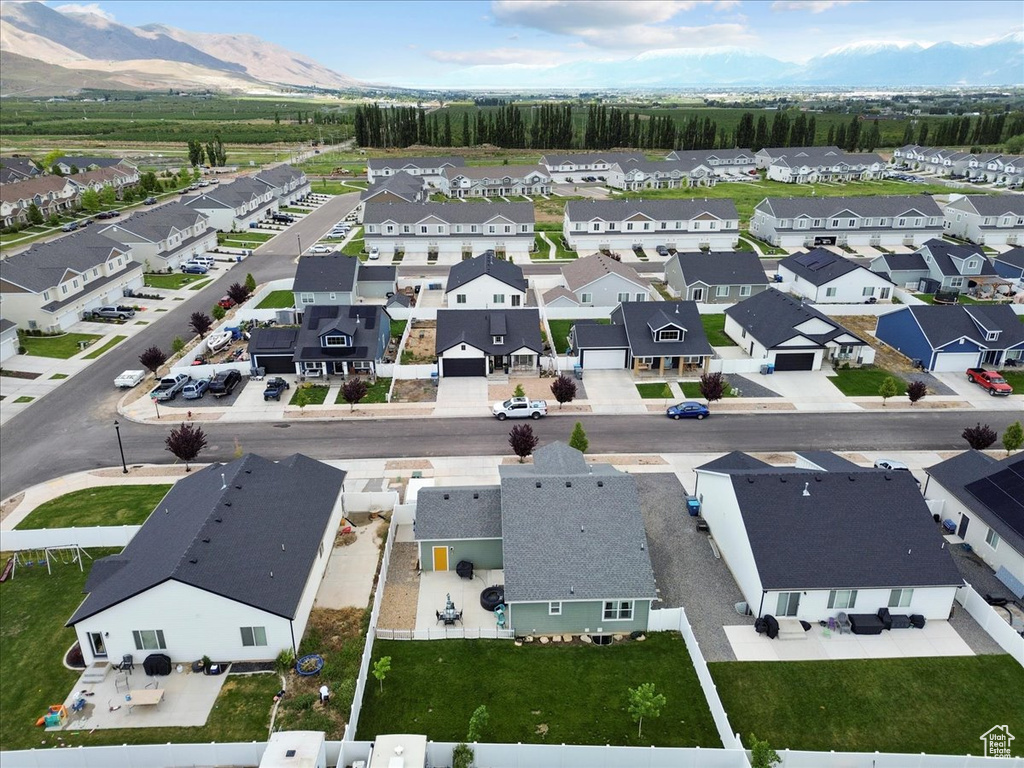 Aerial perspective of suburban area with a mountain backdrop