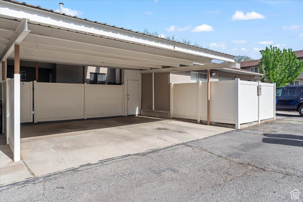 Garage with fence and covered parking