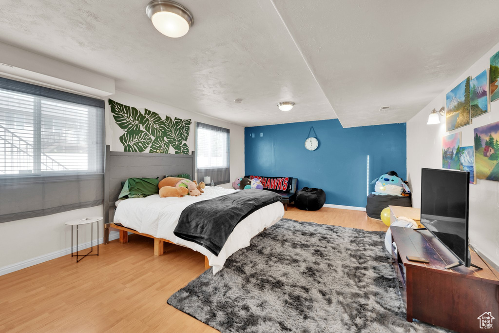 Bedroom with wood finished floors