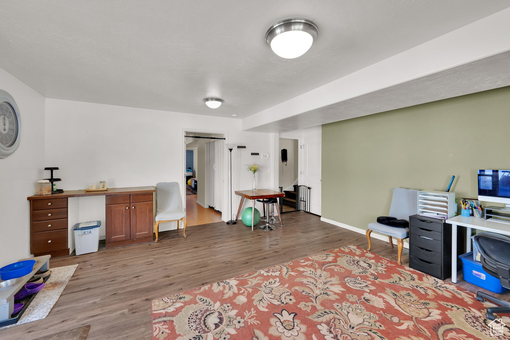 Office featuring wood finished floors and baseboards