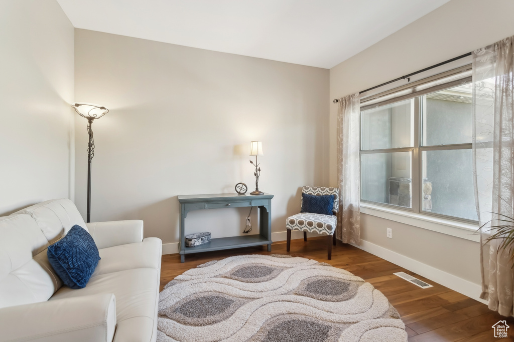Sitting room featuring wood finished floors and baseboards