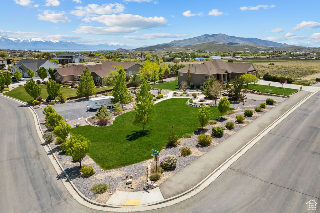 Aerial view of residential area featuring a mountain backdrop