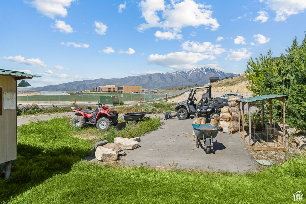 View of patio / terrace featuring a mountain view and fence