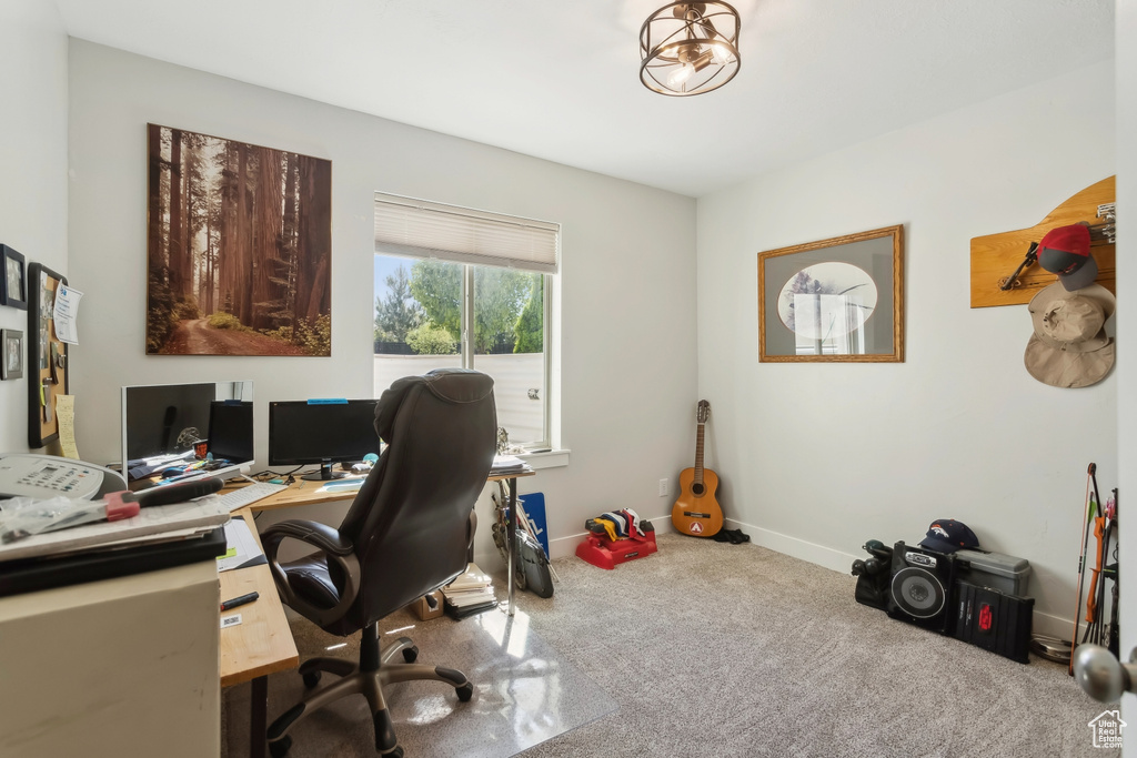 Home office featuring carpet floors and baseboards