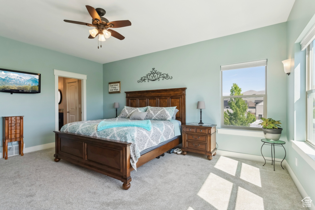 Bedroom featuring carpet flooring, ceiling fan, and baseboards
