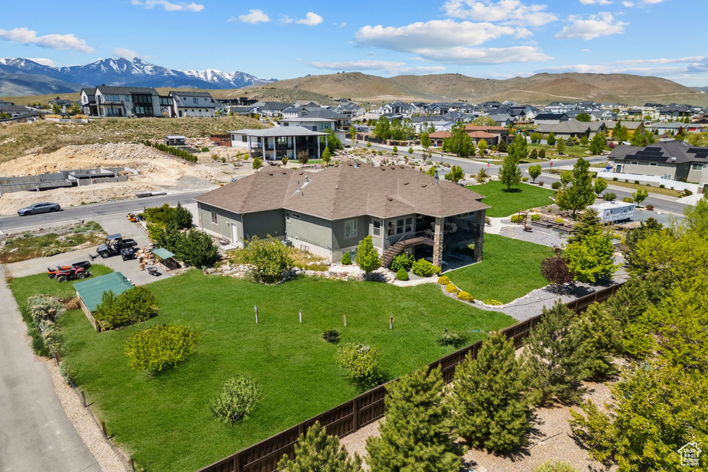 Aerial view of residential area with a mountainous background