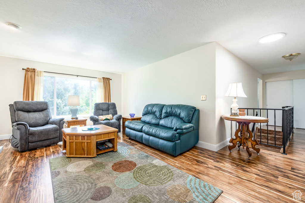 Living area featuring wood finished floors and baseboards