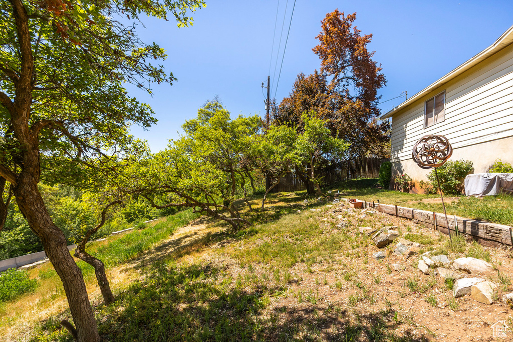 View of yard featuring fence