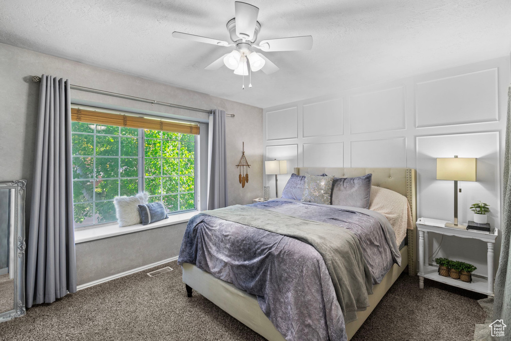 Bedroom featuring carpet flooring and ceiling fan