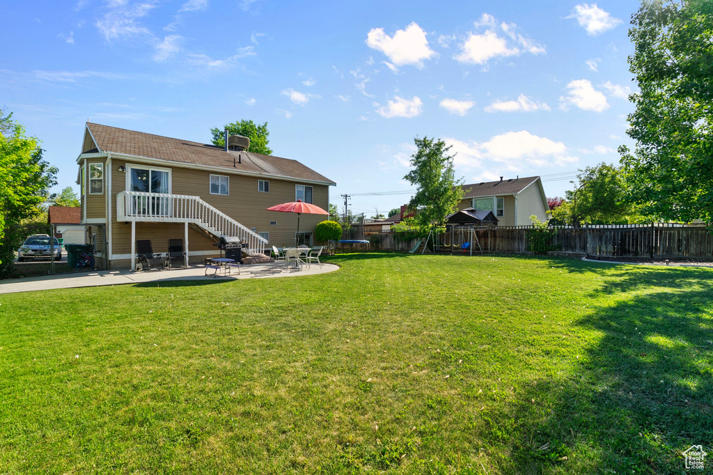 View of yard with a patio and cooling unit