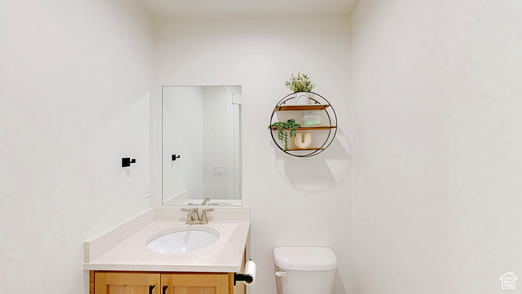 Bathroom featuring toilet and vanity