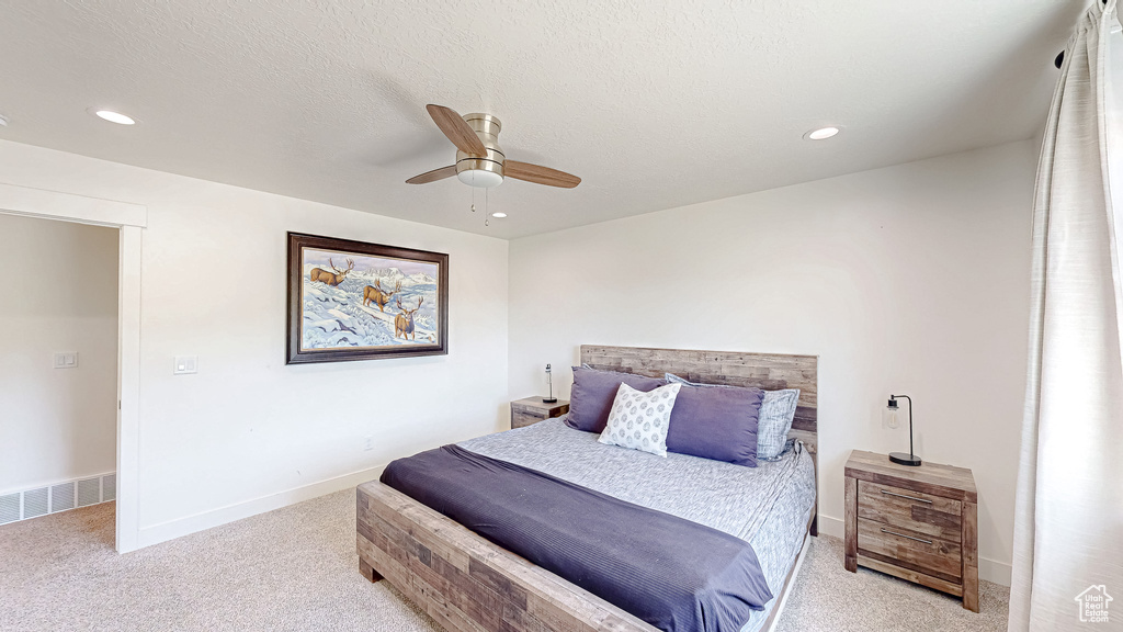 Bedroom featuring light colored carpet, recessed lighting, a ceiling fan, and baseboards