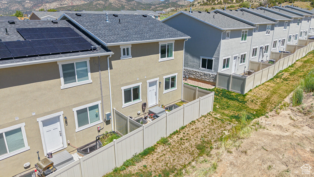 Aerial view of residential area featuring a mountain backdrop
