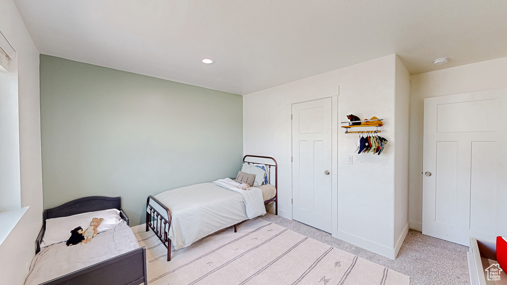 Bedroom with recessed lighting and baseboards