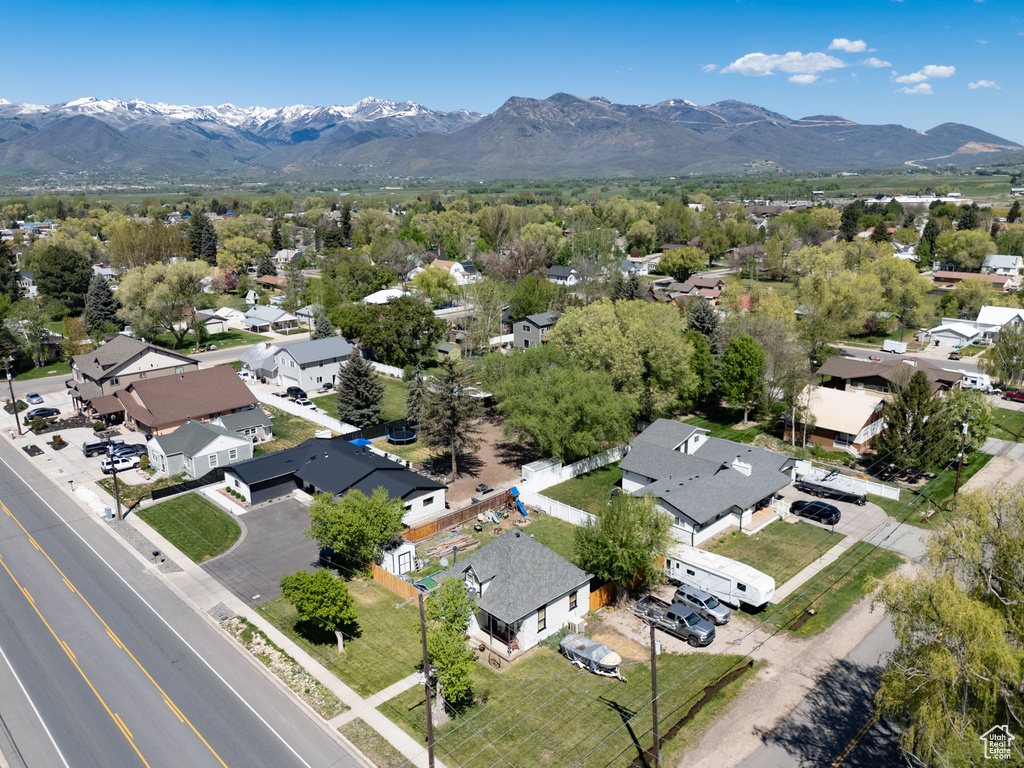 Aerial perspective of suburban area with a mountain backdrop