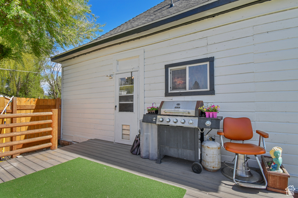 Wooden deck with fence and grilling area