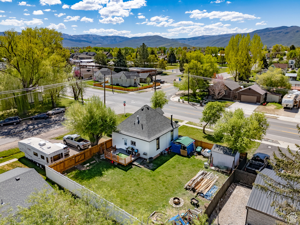 Aerial perspective of suburban area with a mountain backdrop