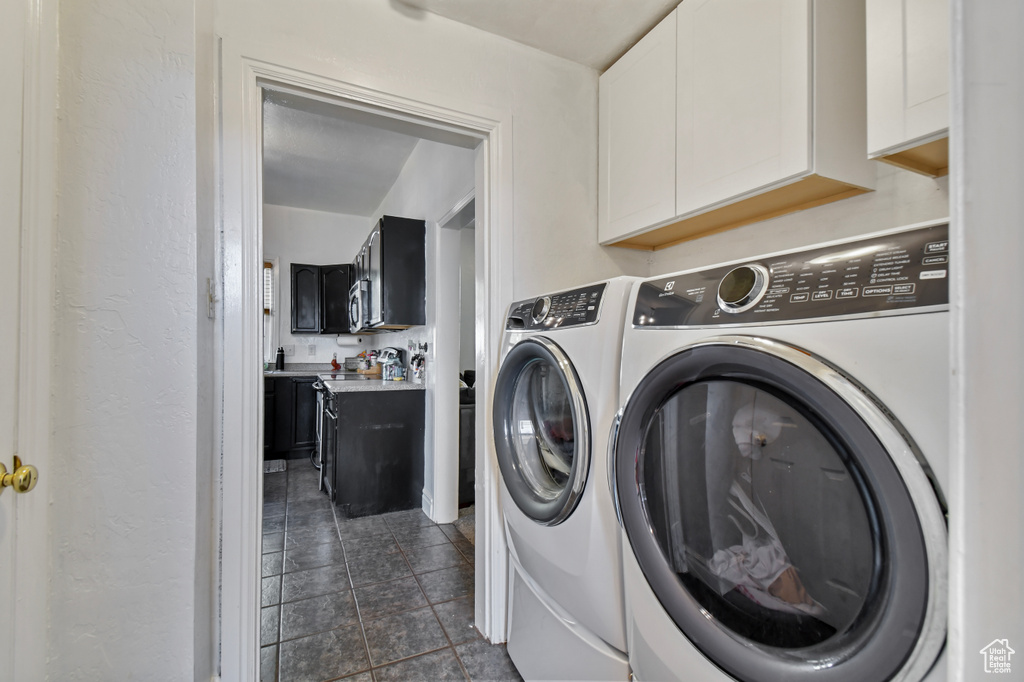 Laundry area with washing machine and clothes dryer and cabinet space