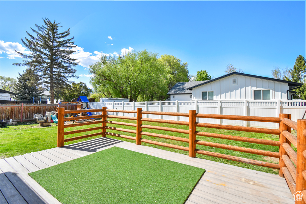Wooden deck with a playground