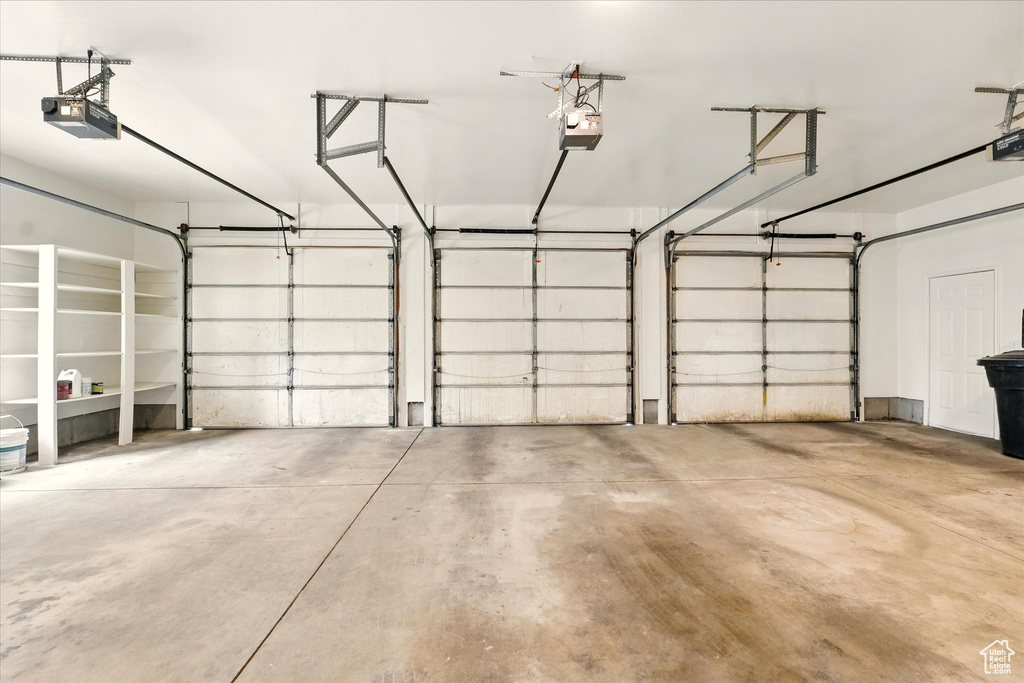 Garage featuring a garage door opener