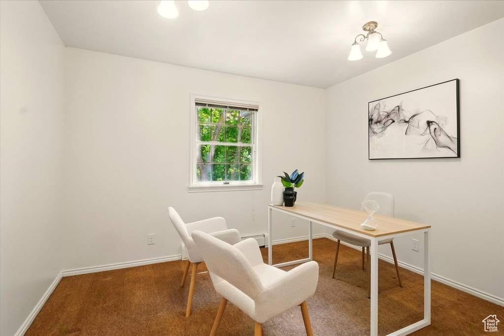 Carpeted office space featuring baseboards and baseboard heating