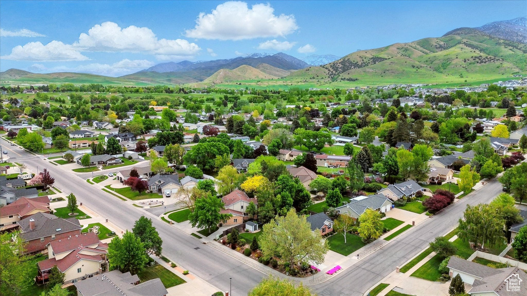 Aerial view of residential area featuring mountains
