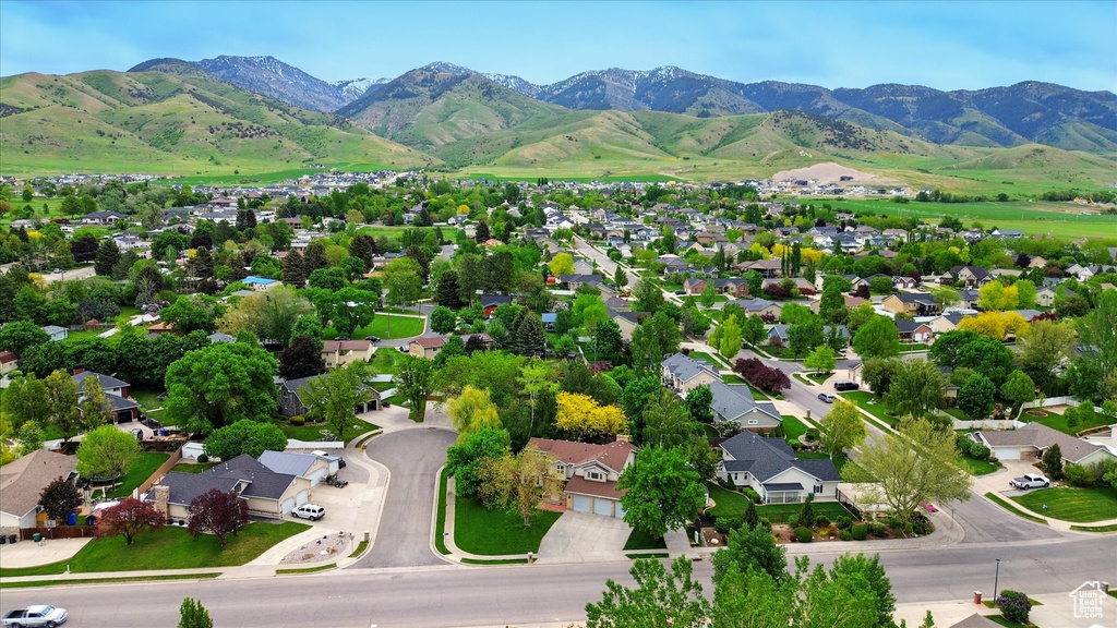 Aerial perspective of suburban area with a mountain backdrop