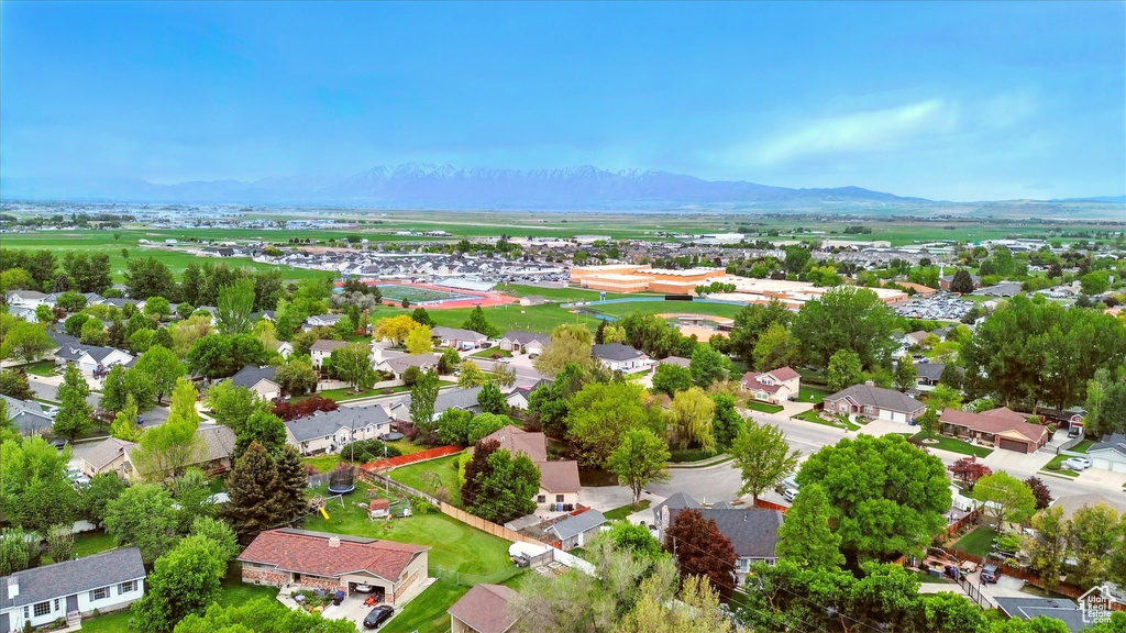 Aerial view of residential area featuring a mountain backdrop