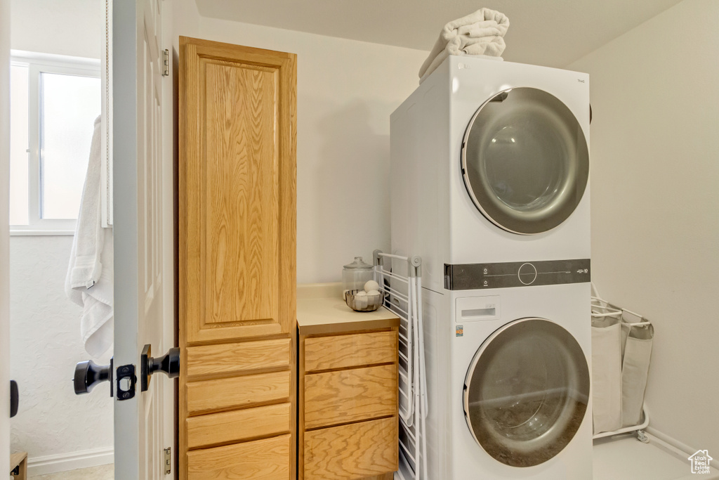 Laundry area with estacked washer and dryer