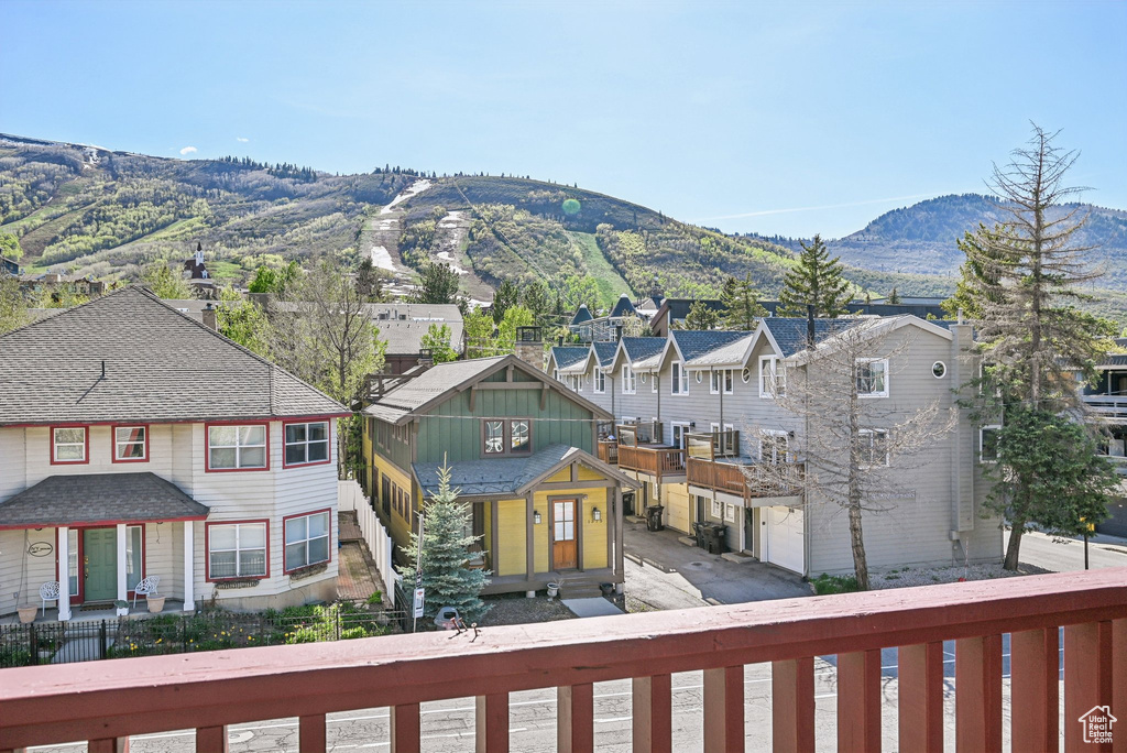 View of mountain backdrop featuring nearby suburban area