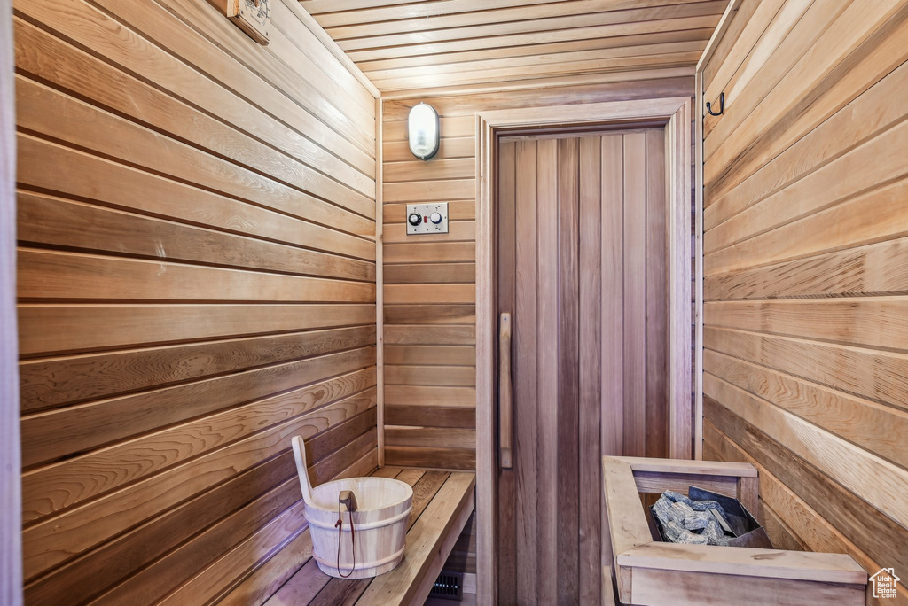 Sauna with wood walls and wooden ceiling