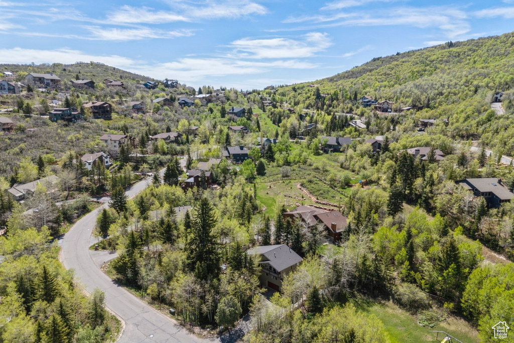 Aerial perspective of suburban area featuring a mountain backdrop