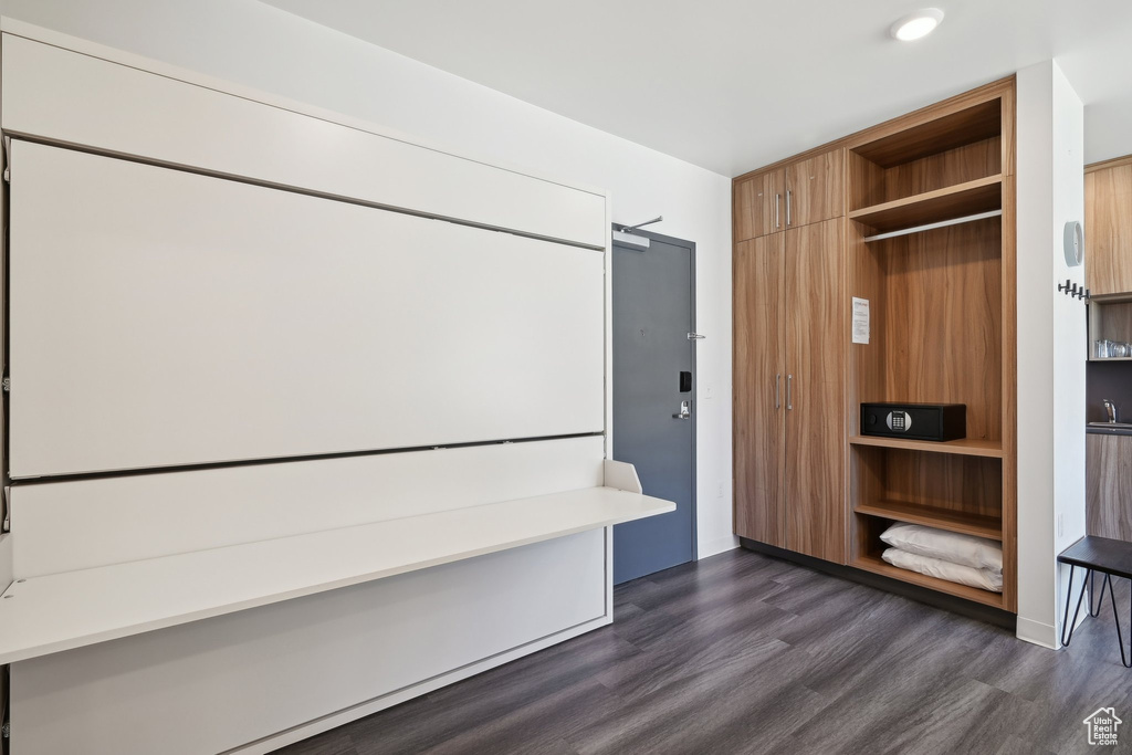 Mudroom featuring dark wood finished floors