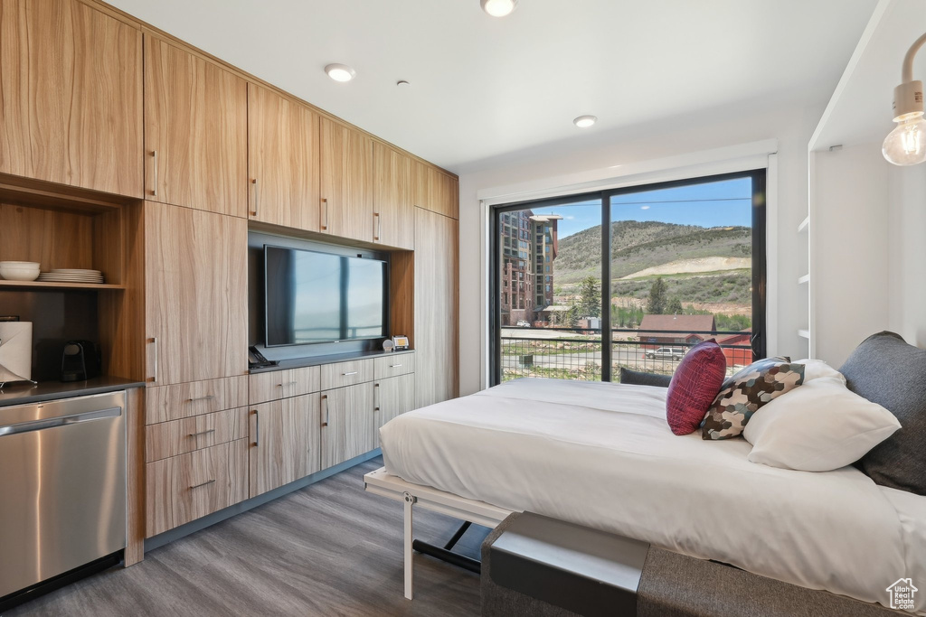 Bedroom featuring wood finished floors and recessed lighting