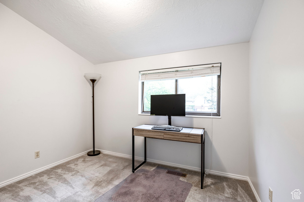 Office with carpet floors and baseboards