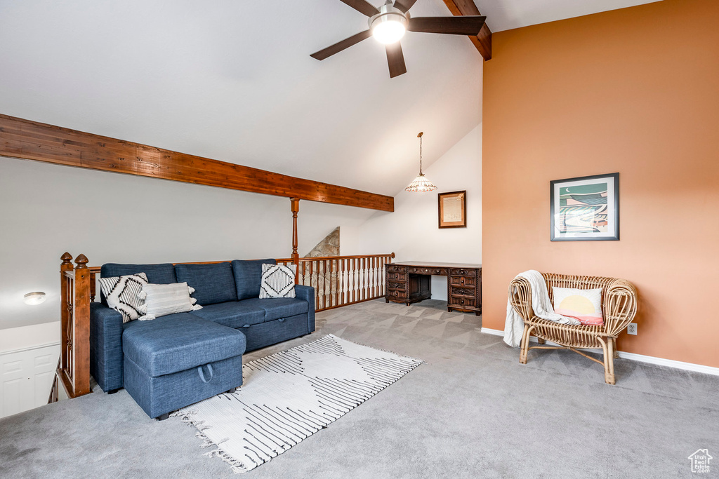 Living room featuring a ceiling fan, carpet flooring, and baseboards