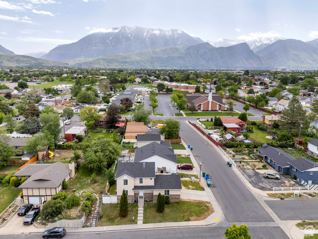 Aerial view of residential area featuring a mountainous background