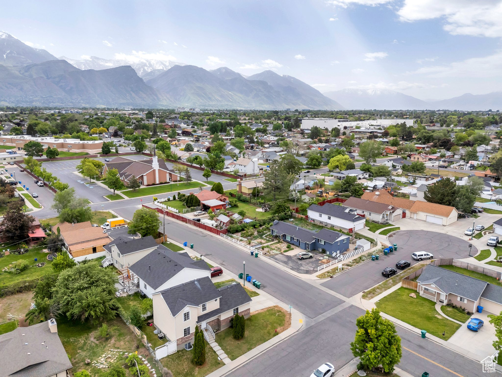 Aerial perspective of suburban area featuring a mountain backdrop