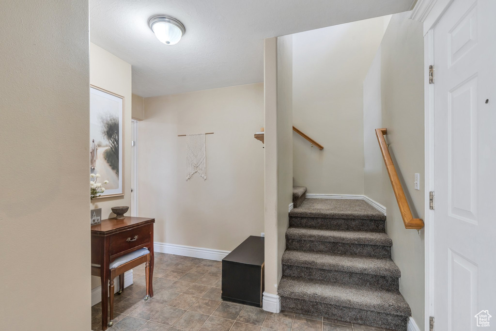 Stairs featuring baseboards