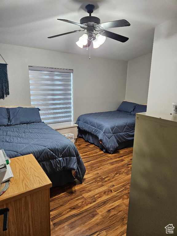 Bedroom featuring wood finished floors and ceiling fan