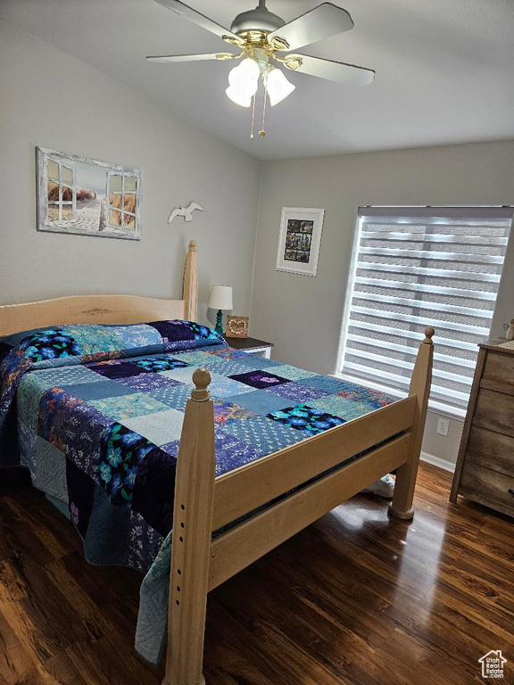 Bedroom featuring wood finished floors and a ceiling fan