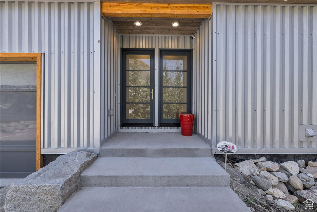 View of exterior entry with board and batten siding