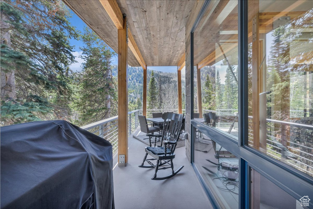 Sunroom featuring healthy amount of natural light and concrete floors