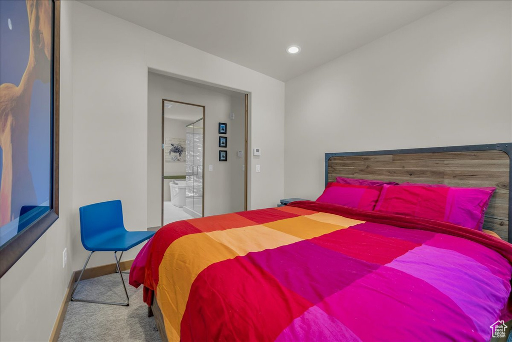 Carpeted bedroom with baseboards and recessed lighting