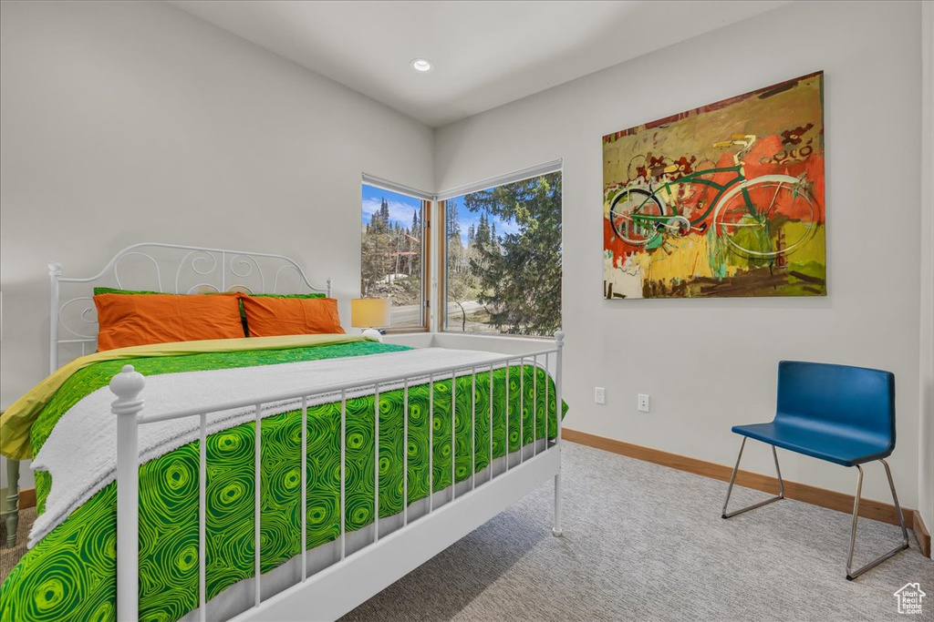 Carpeted bedroom featuring baseboards and recessed lighting