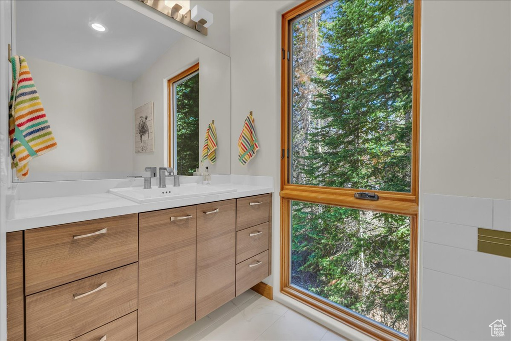 Bathroom featuring vanity and tile patterned flooring