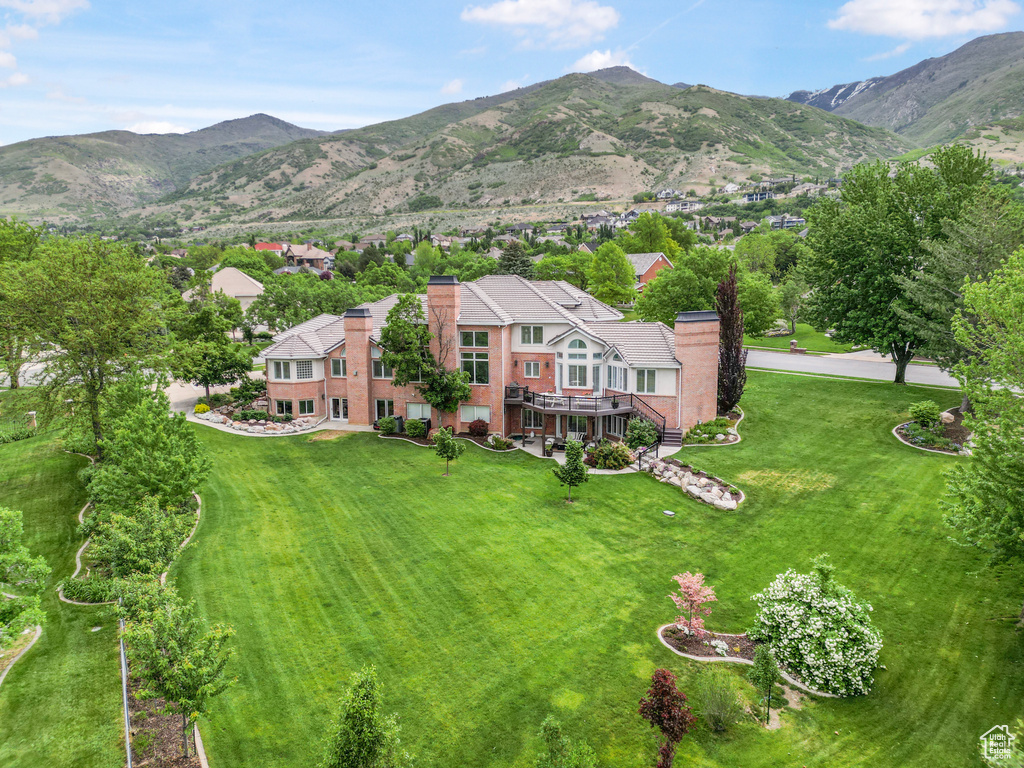 View of subject property with a mountain backdrop