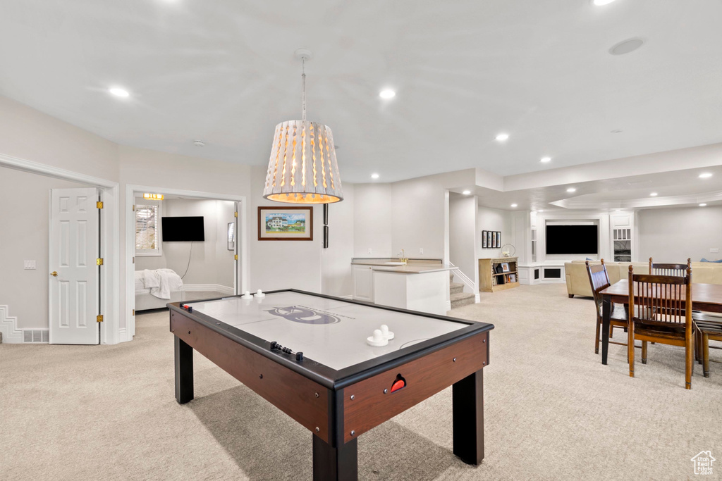 Game room featuring light carpet, recessed lighting, and baseboards