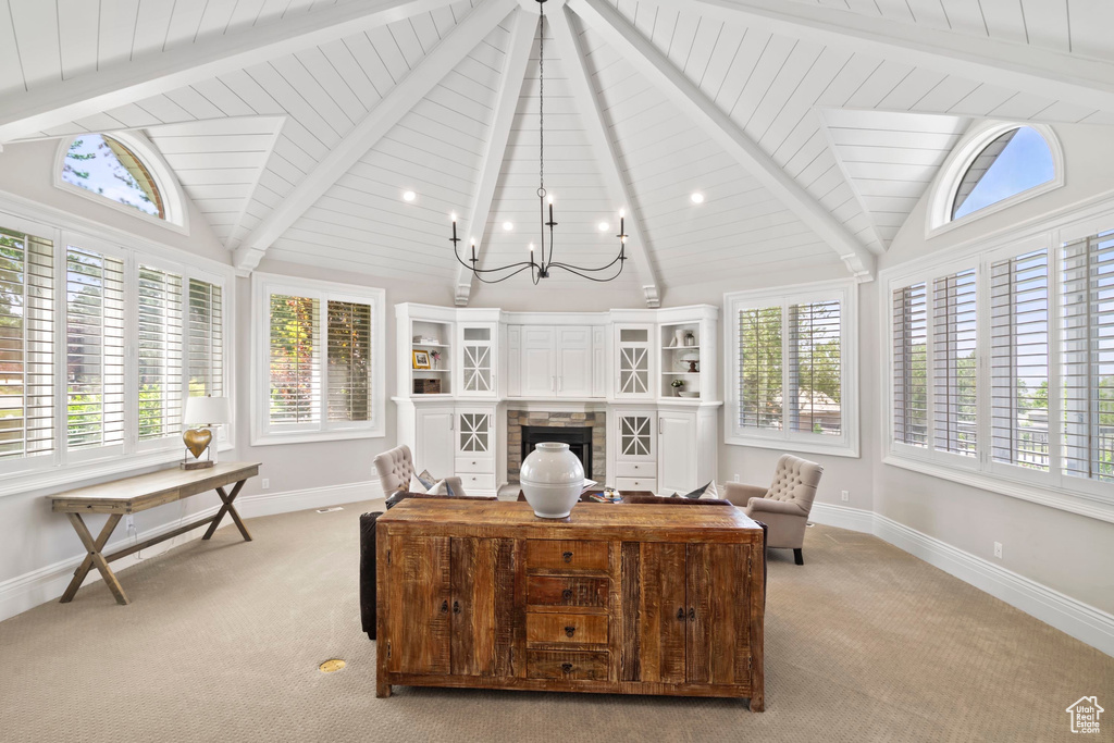 Office featuring light carpet, healthy amount of natural light, baseboards, a chandelier, and wooden ceiling