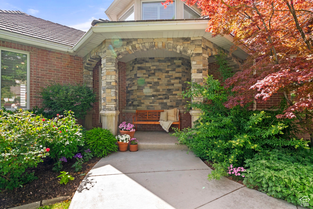 Doorway to property with brick siding